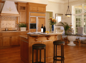 French provincial kitchen and dining room with wooden furniture and hardwood flooring