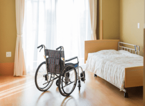 Wheelchair and bed in a room