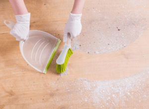 Cleaning the floors with dust pan