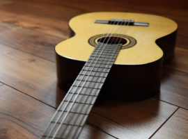 guitar-on-laminate-floorboards