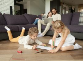 Family playing on engineered hardwood flooring