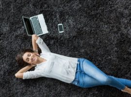 Woman lying on black carpet
