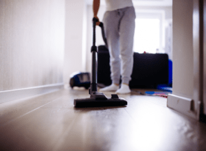 resident vacuums floor