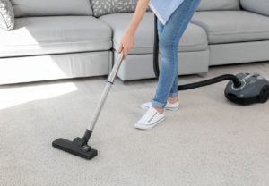 Cleaning carpet with vacuum cleaner