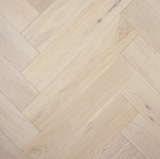 Herrinbone flooring in light beige colour.